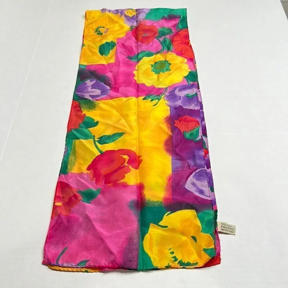 Vibrant floral silk scarf with gold purple pink and red flowers.